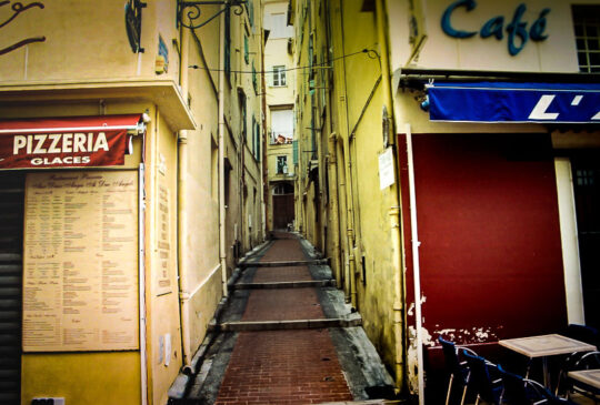 Yellow stairs up red pizza blue cafe